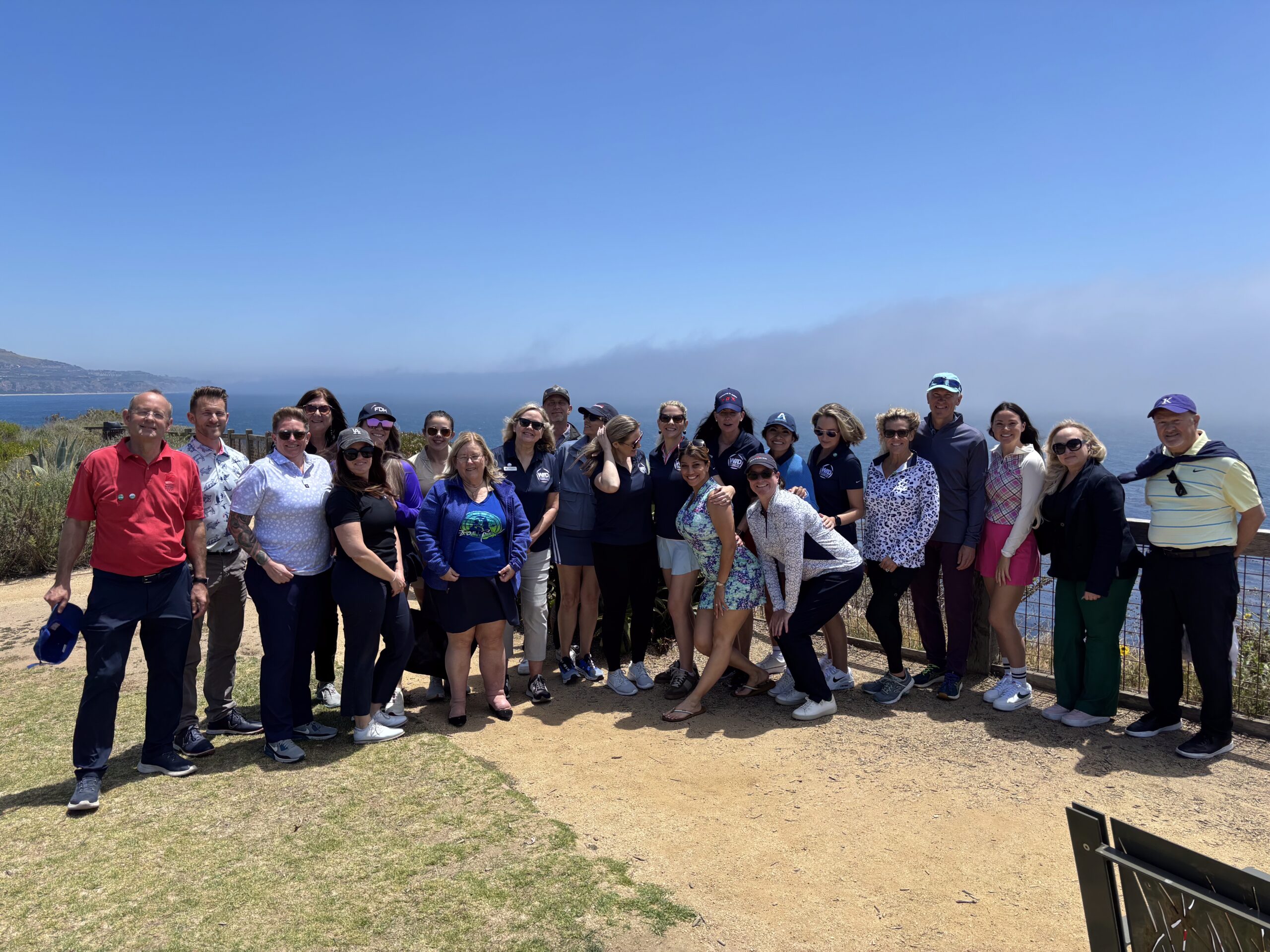 Attendees from the WID GLAC golf clinic pose for a photo together.